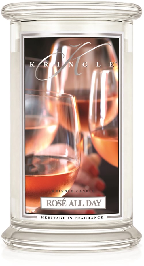  Ett ljus med en bild av vinglas och texten "ROSE ALL DAY" och "HERITAGE IN FRAGRANCE."
