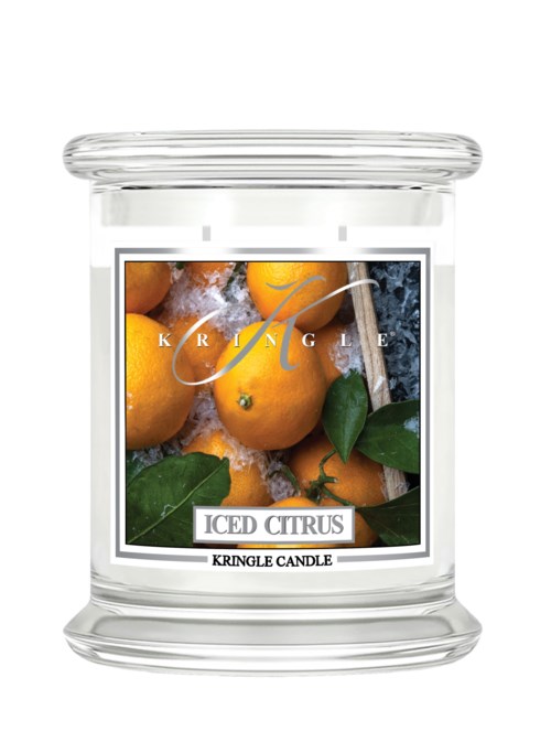 Ett tydligt glasljus med etikett av apelsiner och blad, märkt 'ICED CITRUS' och 'KRINGLE CANDLE'.