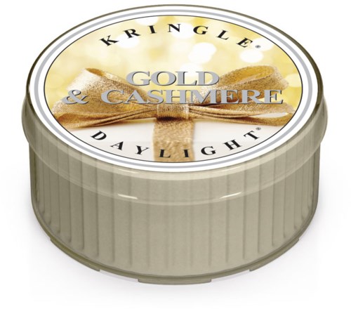 En rund boks med etikett som sier Kringle Daylight, duft av Guld & Cashmere, med gullbånddesign.