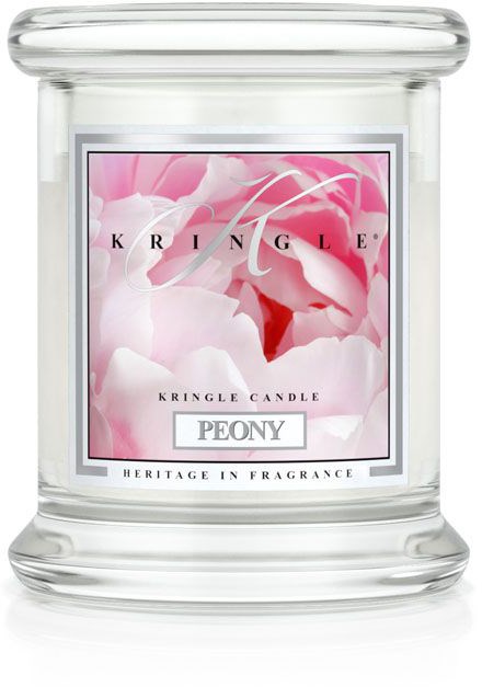 En tydlig glasljushållare med en etikett som visar rosa blommor, varumärket Kringle och doften Peony.