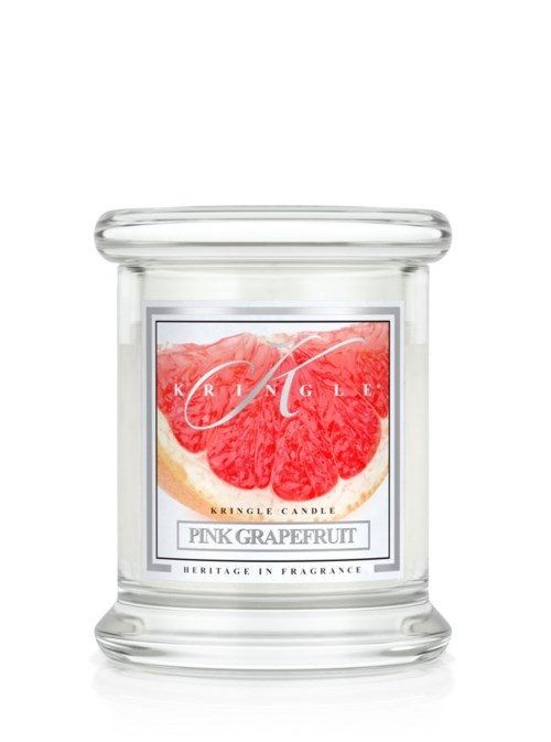 Ett tydligt glas för doftljus med en etikett som visar en skiva rosa grapefrukt och text om doften.
