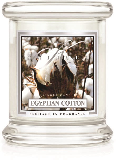 Ett vitt glaslykta med bomullsbild, etiketten säger 'Egyptian Cotton' och 'Heritage in Fragrance'.