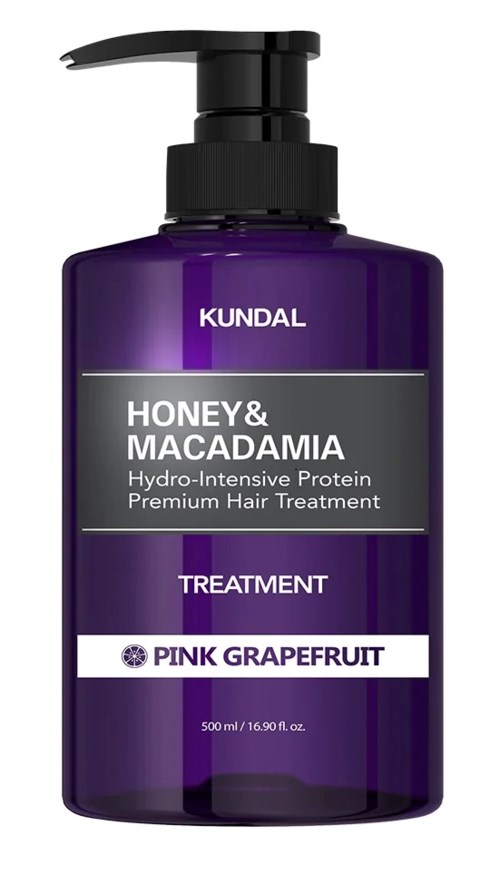 A purple hair treatment bottle with a pump, labeled as KUNDAL Honey & Macadamia, pink grapefruit flavor.