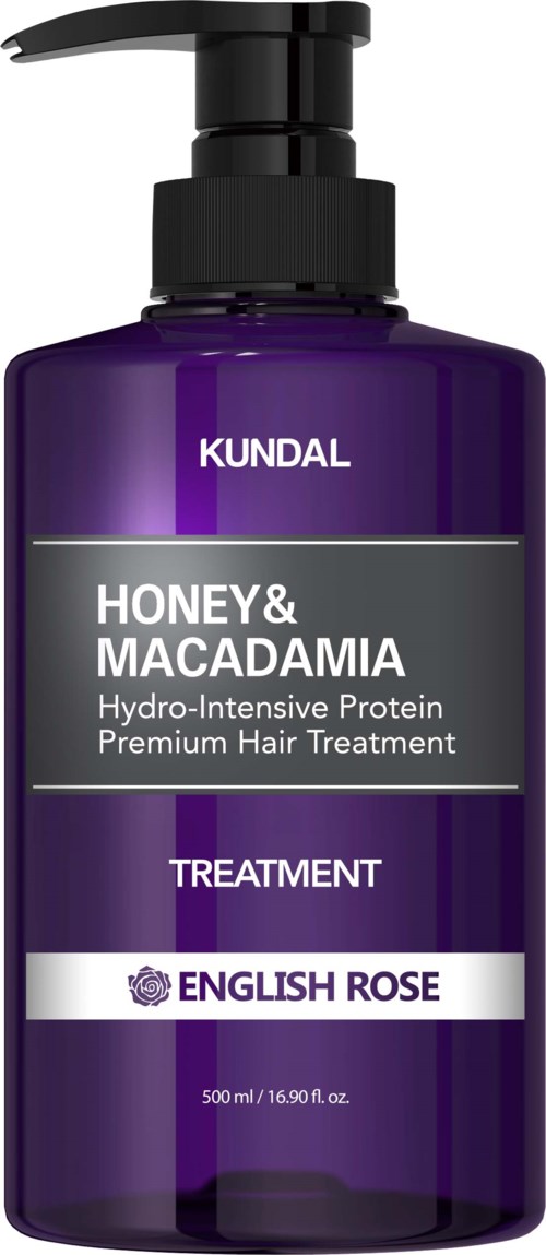 A purple bottle of KUNDAL honey and macadamia hair treatment with a pump dispenser.