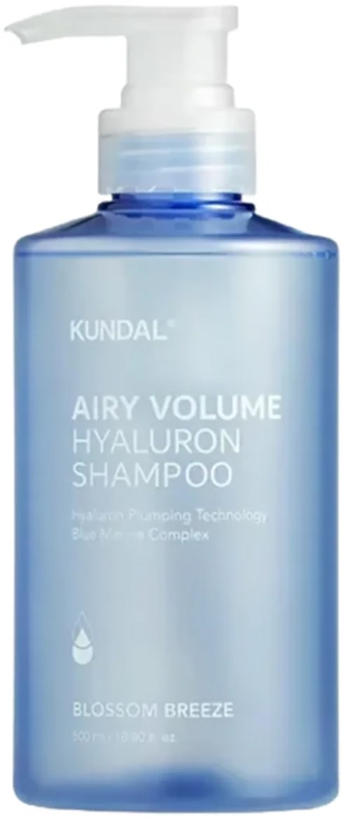 A blue bottle of KUNDAL AIRY VOLUME HYALURON SHAMPOO with a pump, labeled for hair care with blossom scent.