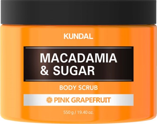 Oransje beholder av kroppsskrubb merket 'Macadamia & Sugar' med pink grapefrukt duft.