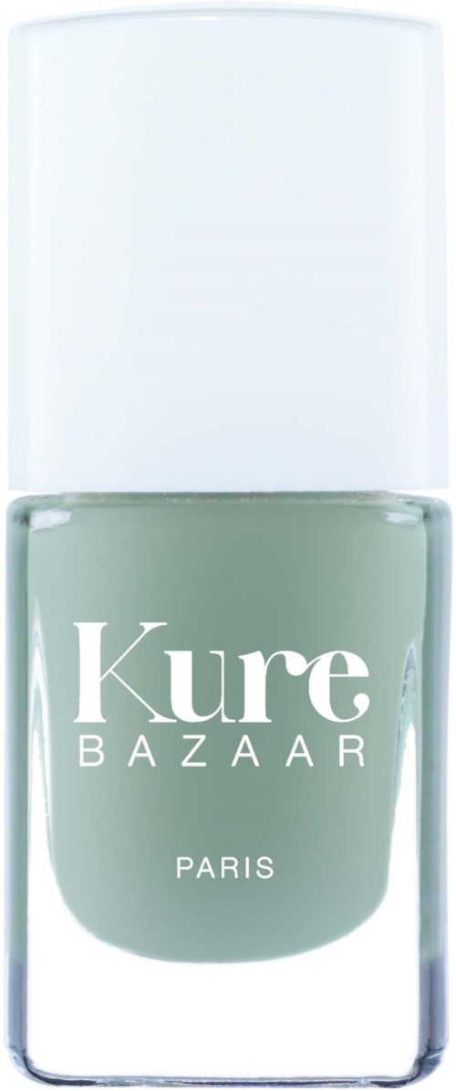 A nail polish bottle labeled 'Kure BAZAAR PARIS' with a white cap and grayish-green color.