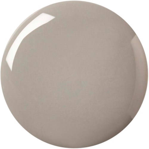 A plain, round, beige plate with a shiny surface and no decorations.
