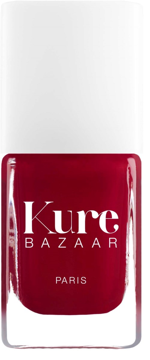 Rød neglelakkflaske med hvit hette, merket Kure Bazaar Paris.