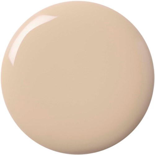 En stor beige cirkulär objekt med en glänsande reflektion upptill, liknar ett slätt, runt föremål.
