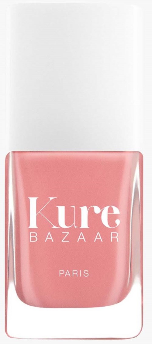 En pink neglelakflaske med hvid kork, mærket "Kure BAZAAR PARIS."