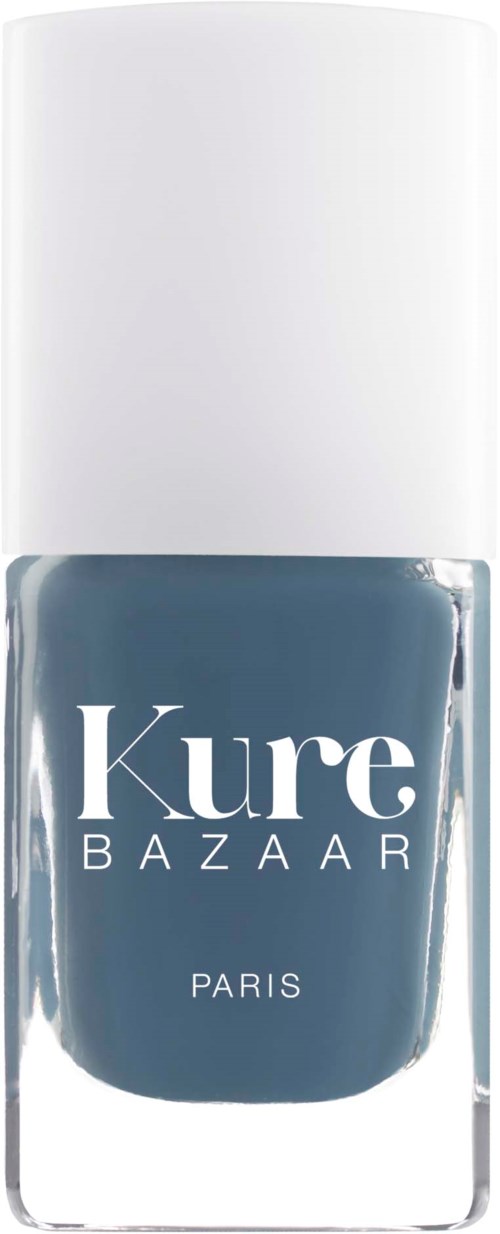 En neglelakkflaske med hvit kork, mørk blå farge, merket Kure Bazaar Paris.