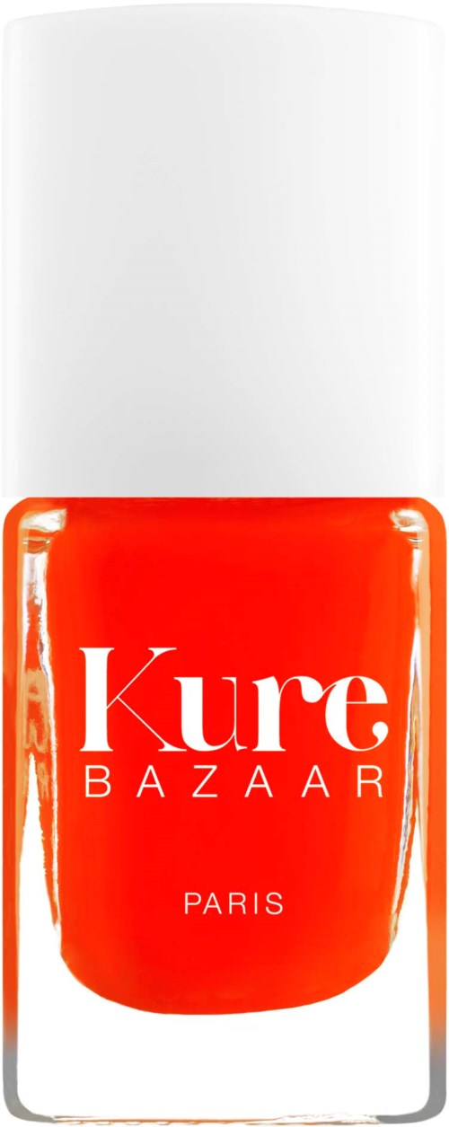 A bottle of orange nail polish with a white cap, labeled 'Kure Bazaar Paris'.