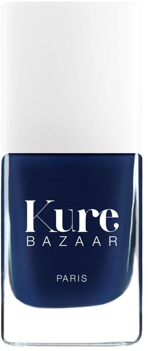 A nail polish bottle with a white cap and dark blue polish inside, labeled 'Kure Bazaar Paris.'