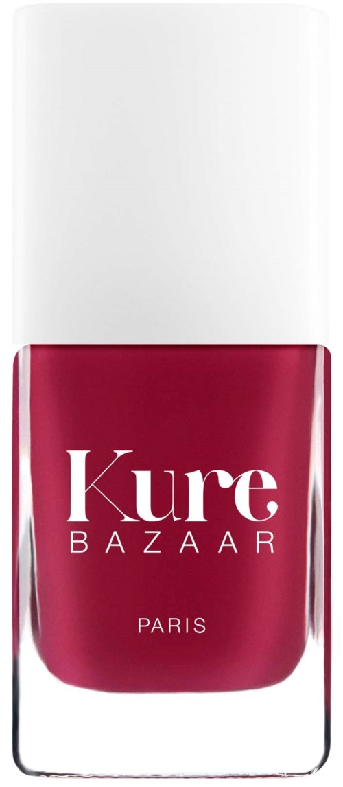 En neglelakkflaske med hvit hette og dyp rosa væske inni, merket 'Kure BAZAAR PARIS'.