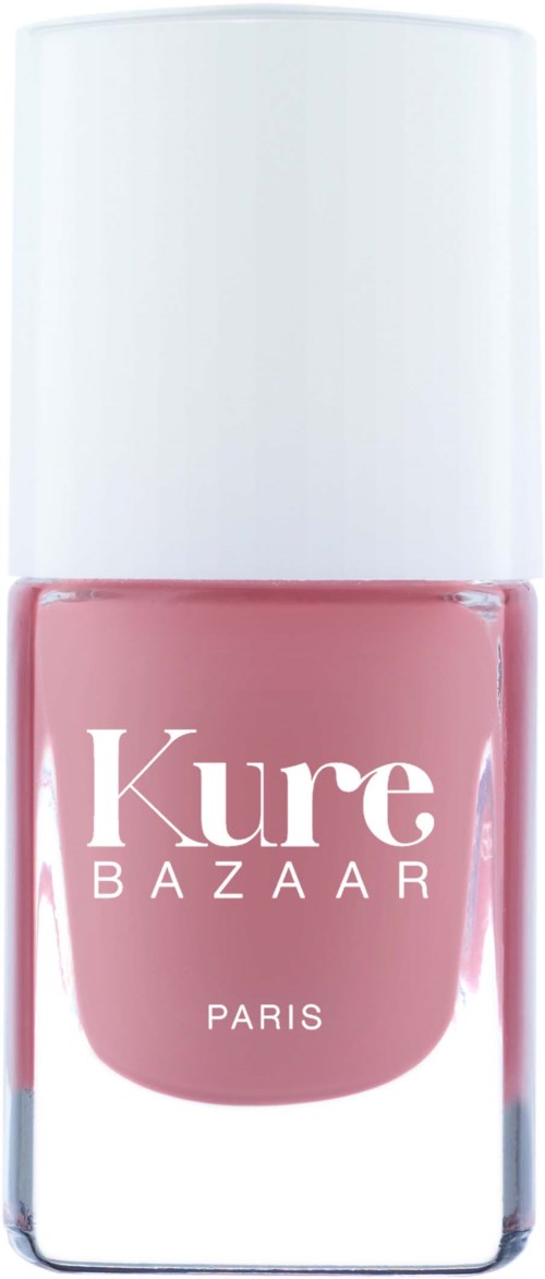 En nagellackflaska med rosa lack och vit lock, märkt Kure Bazaar Paris.