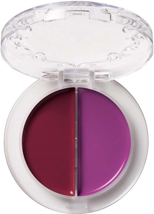 A small round makeup container with two shades of purple, one dark red and bright pink, separated by a dividing line.