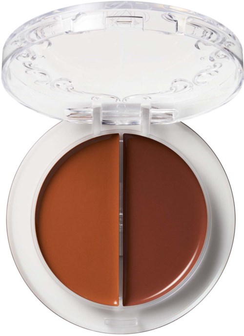 A round makeup compact with two different shades of brown, one light and one dark, in a white case with a clear lid.
