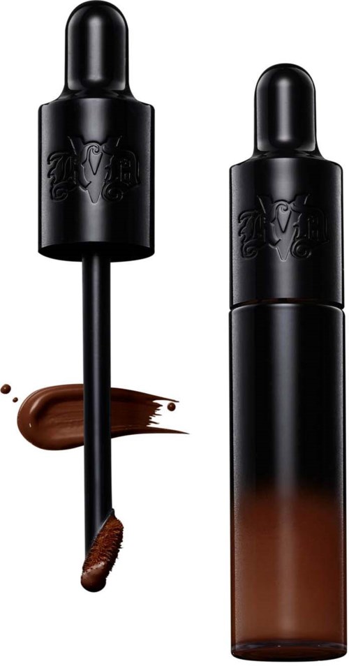 Black bottle with a dropper, brown liquid visible, label with a dragon logo, likely a cosmetic or skincare product.