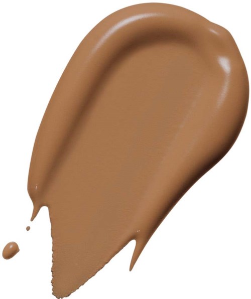 A creamy, brown liquid spread in a swipe with a small dot on the side.
