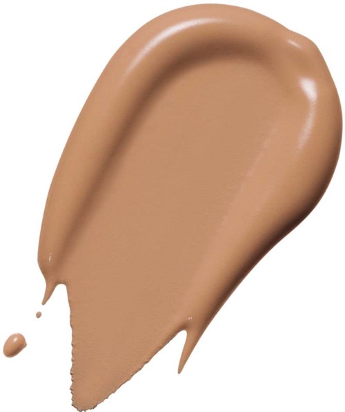 A beige-colored liquid foundation smear with a small drop on the side.