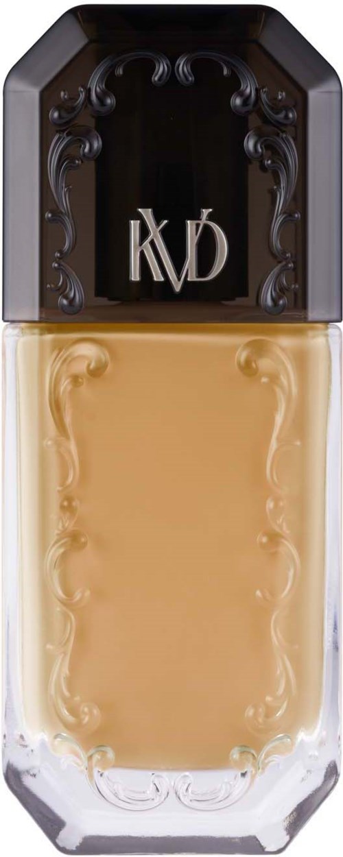 Eine Flasche mit schwarzem Verschluss und transparenter Körper zeigt beige Flüssigkeit. Der Verschluss hat ein dekoratives schwarzes Design.