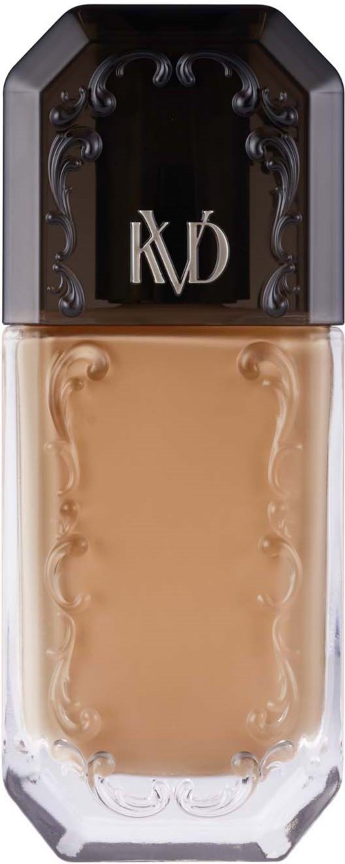 Eine Foundation-Flasche mit schwarzem Deckel und goldener Aufschrift KCVD, enthält beige Farbe.