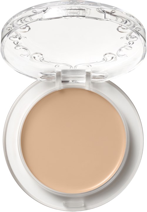 A compact with beige foundation and a clear lid, used for face makeup.