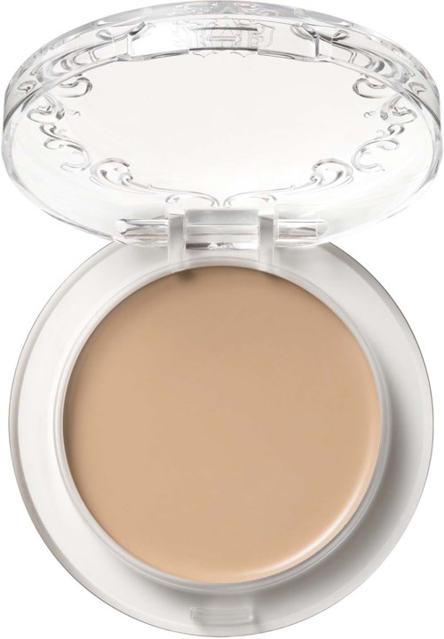 En liten dosa med beige färgad fast makeup, öppen lock visar ett tydligt dekorativt mönster.