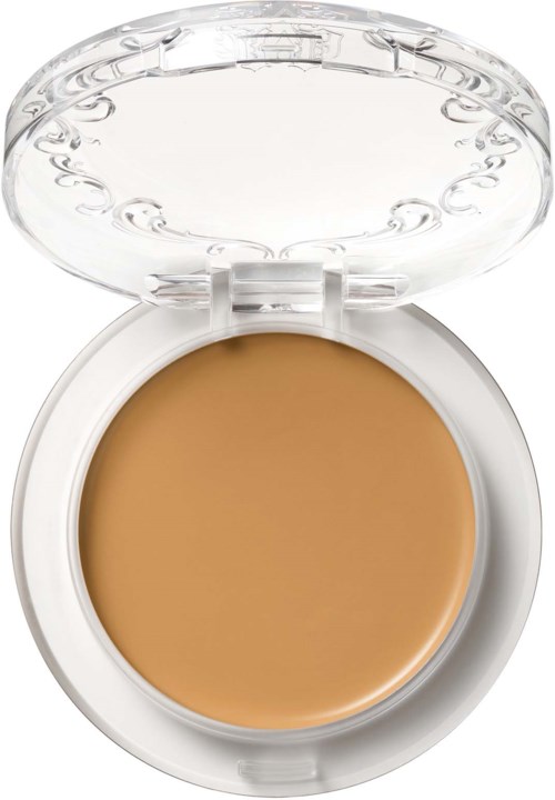 En rund makeuppalett med en tydlig lock som visar beige foundation inuti.