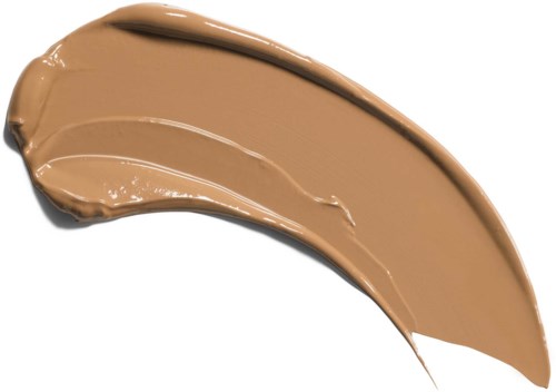 En kurvad strykning av beigefärgad vätska, tjock och krämig, kanske makeup eller lotion.