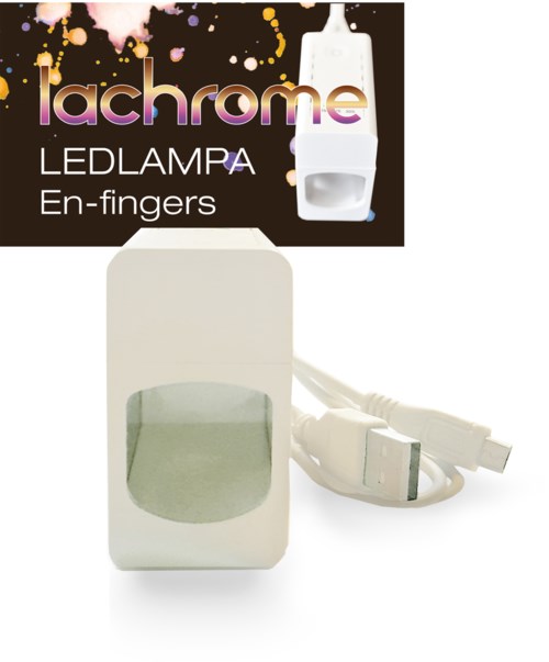 Liten vit LED-lampa med strömkabel och kontakt, avsedd för fingeranvändning. Packningen visar märket "lachrome" med färgglad design.