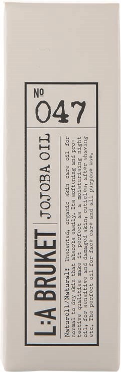 A white box with a label showing a number 047 and text about jojoba oil.