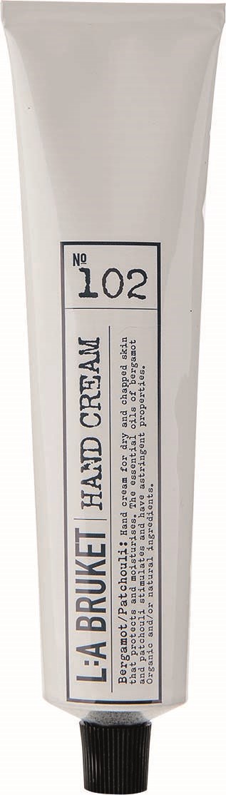 A white tube labeled L'ABRUQUET HAND CREAM with the number 102 and black cap.
