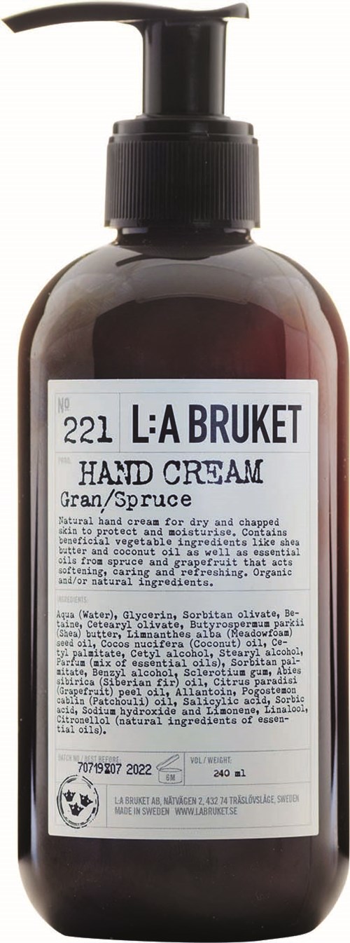 A dark brown bottle with a black pump contains L:A BRUKET hand cream, labeled with description and ingredients.
