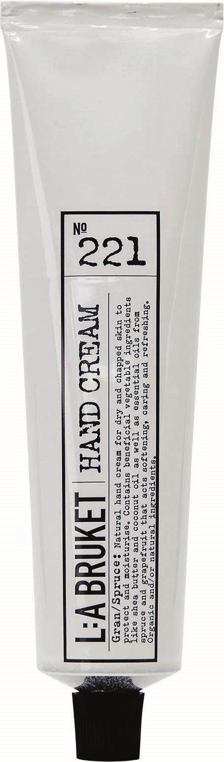 En hvit tube med svart kork, merket "L.A. BURKET HAND CREAM" og nummer 221.