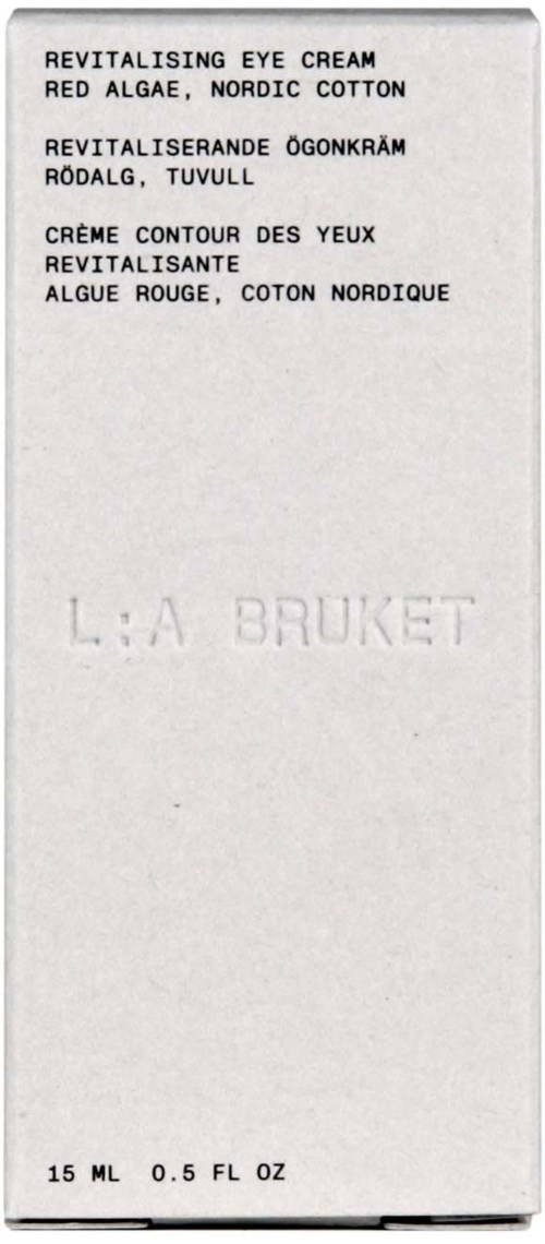 A white box with black text describing eye cream ingredients and brand name, 'L:A BRUKET.'
