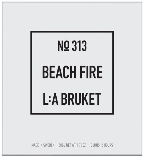 A label with text: 'No 313 Beach Fire L:A Bruket,' made in Sweden, 50g, burns for 16 hours.