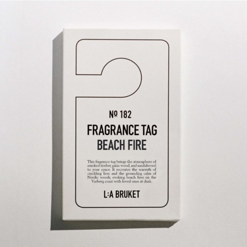 Fragrance tag labeled 'Beach Fire' with a simple design and text describing the scent.