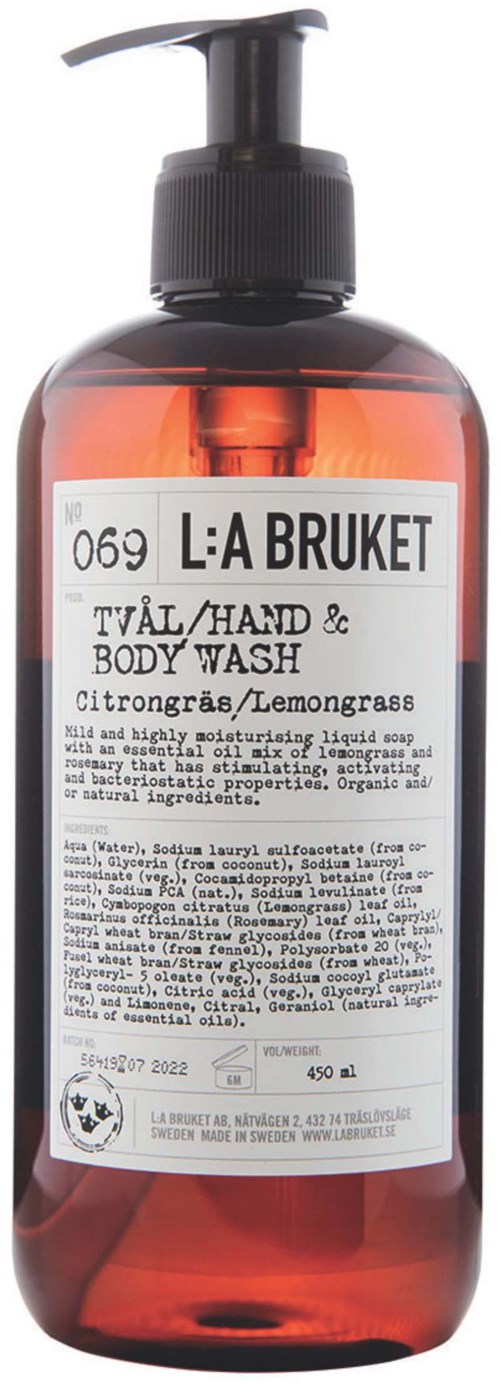 En flaska med citrongräsduschgel för händer och kropp med pump. Den har en vit etikett med svart text och varumärkesnamn.