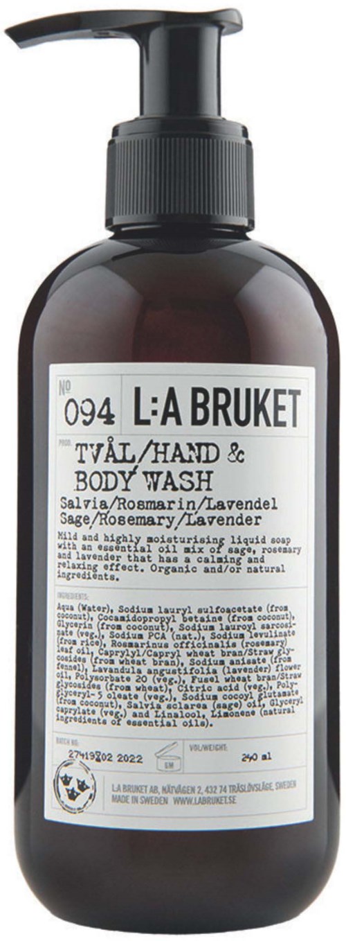 En mörkbrun flaska med vit etikett och svart pump, märkt som hand- och kroppstvål med lavendeldoft.