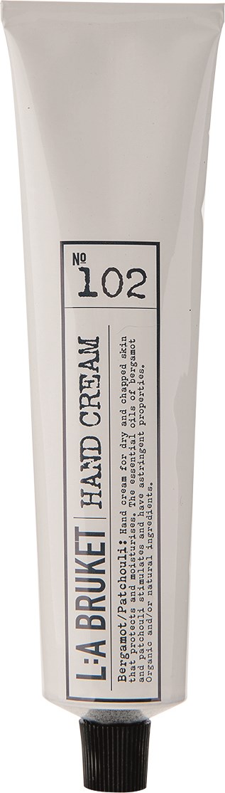 En tub handkräm märkt 'LÄÄ BRUET HADI CREAM' med nummer 102. Den har en svart kork.