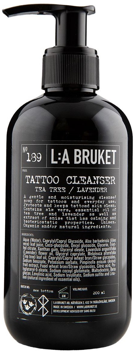 A black bottle with a pump, labeled as L:A Bruket Tattoo Cleanser, for gentle skin cleaning and moisturizing.