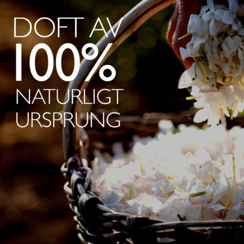 Teksten sier: "Lukt av 100% naturlig opprinnelse." Bakgrunn viser hvite blomsterblader og blomster i en kurv.