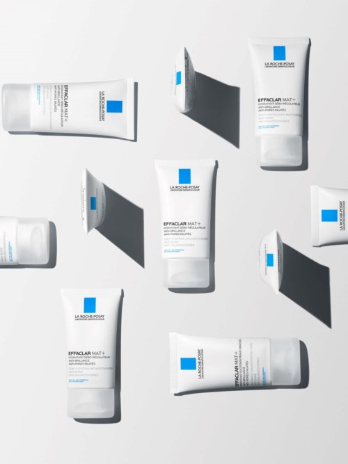 Useita ihonhoitotuotteiden putkia, joissa lukee 'Effaclar Mat', varjoja valkoisella taustalla.