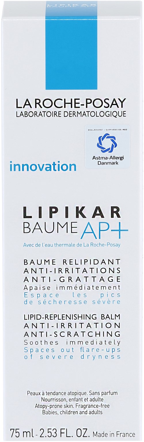 En vit och blå La Roche-Posay Lipikar Baume AP+-flaska för torr hud. Den nämner anti-irriterande och lugnande effekter.