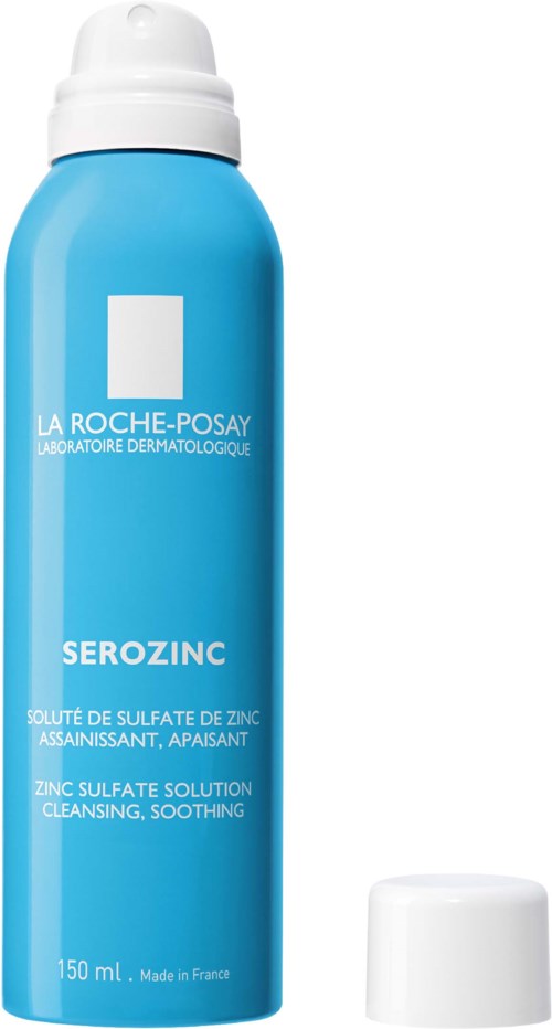 Niebieska butelka La Roche-Posay Serozinc, łagodząca mgiełka do skóry z siarczanem cynku. Nakrętka zdjęta. Tekst opisuje produkt.