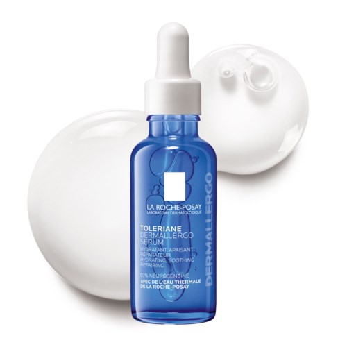 Blå serumflaska framför vita cirkulära bakgrunder, märkt La Roche-Posay Toleriane Dermallergo Serum.