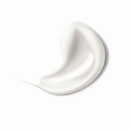 En klick av vitt krämen eller lotion med en slät, kurvig form på en ren vit bakgrund.