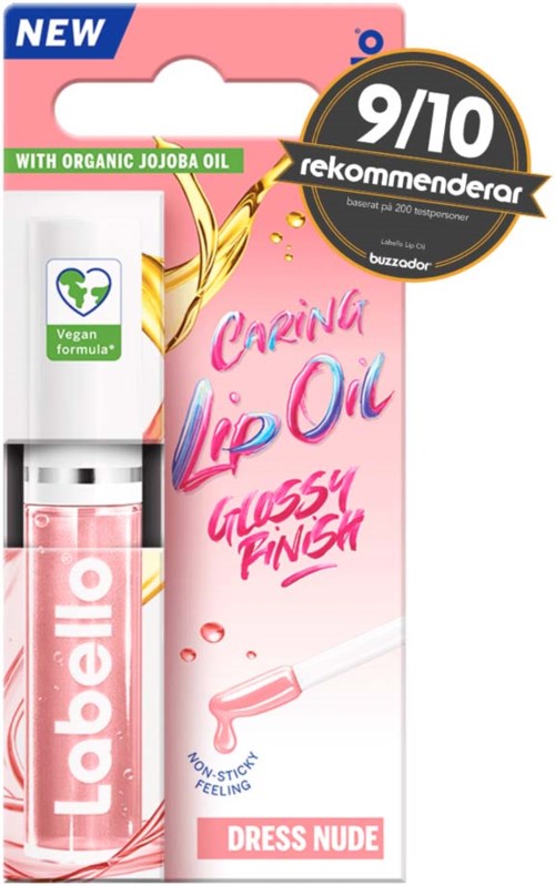 Tuba z olejem do ust w różowej oprawie, oznaczona 'Dressing Nude,' i czarnym odznaką z wynikiem 9/10. Zawiera organiczny olej jojoba.